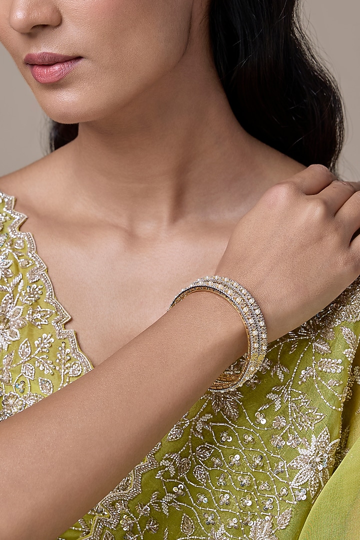Gold Finish Zircon & Pearl Bangles (Set Of 2) by Moh-Maya by Disha Khatri at Pernia's Pop Up Shop