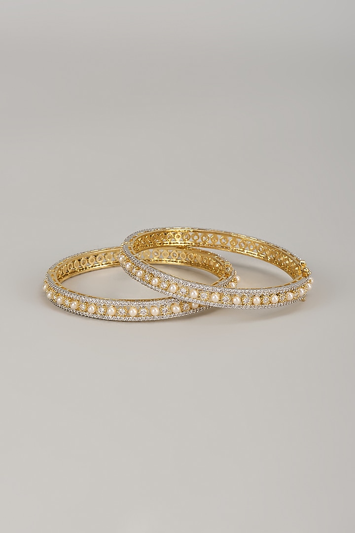 Gold Finish Zircon & Pearl Bangles (Set Of 2) by Moh-Maya by Disha Khatri at Pernia's Pop Up Shop