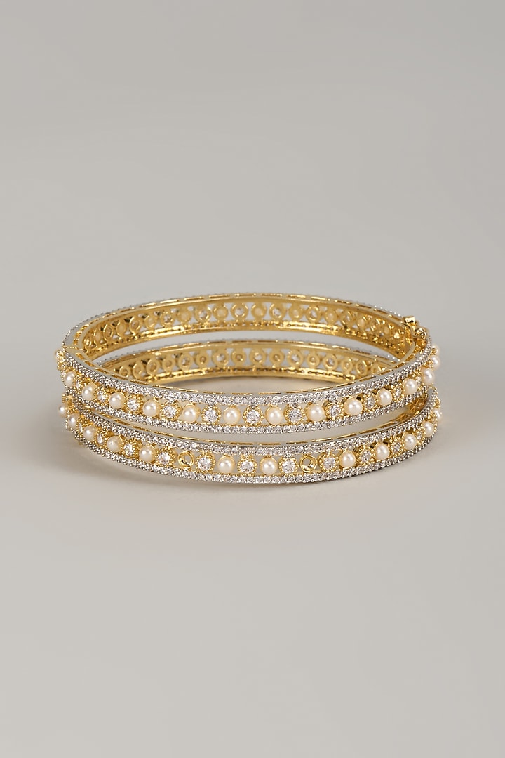 Gold Finish Zircon & Pearl Bangles (Set Of 2) by Moh-Maya by Disha Khatri at Pernia's Pop Up Shop