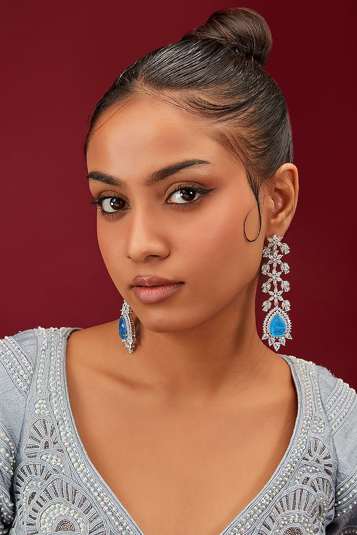 White Finish Zircon & Blue Stone Dangler Earrings by Moh-Maya by Disha Khatri at Pernia's Pop Up Shop