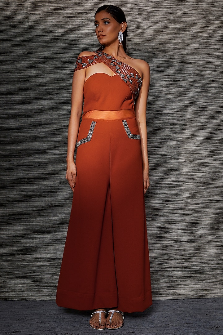 Rust Stretch Suiting & Sheer Net Embroidered One-Shoulder Jumpsuit by Mehak Murpana