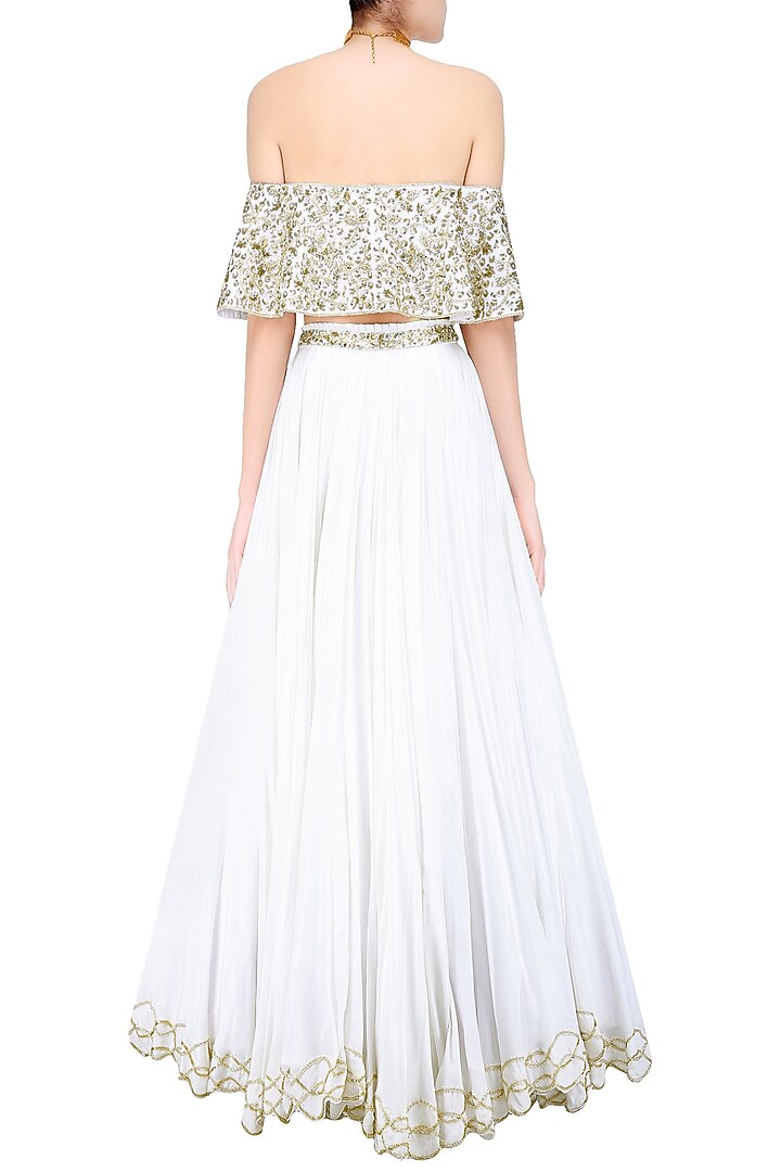 Ivory floral embroidered off shoulder blouse and lehenga skirt set available only at Pernia's Pop Up Shop.