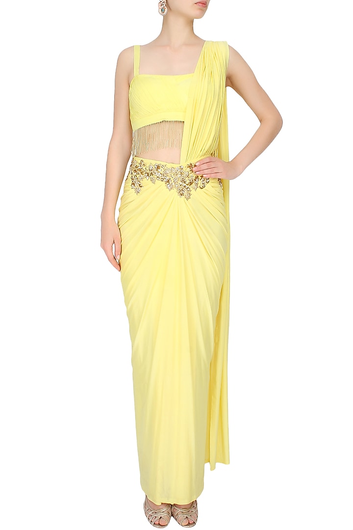 Yellow and gold floral embroidered drape saree with starppy fringes blouse available only at Pernia's Pop Up Shop.