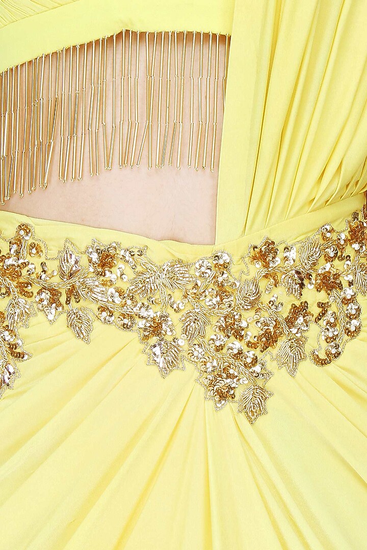 Yellow and gold floral embroidered drape saree with starppy fringes blouse available only at Pernia's Pop Up Shop.