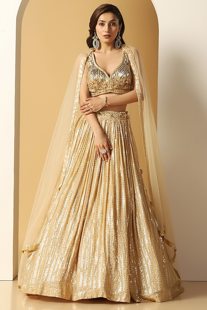 Gold Georgette Cutdana Embroidered Lehenga Set by MeenaGurnam