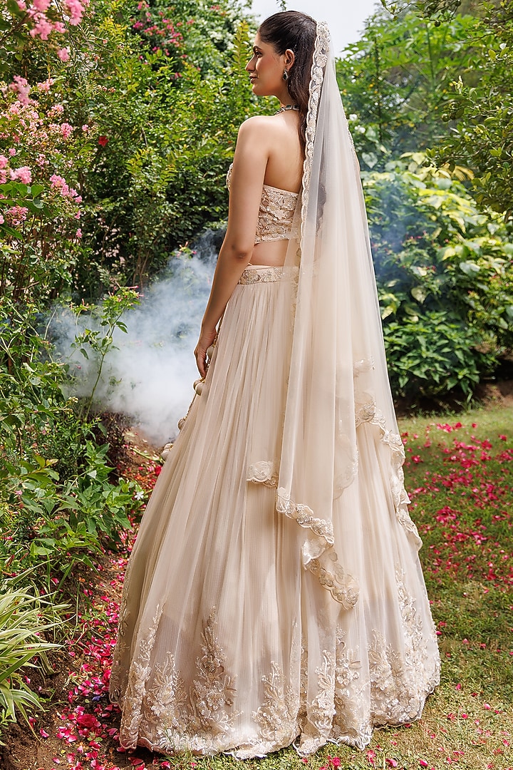 Golden Net 3D Floral Embellished Wedding Lehenga Set by MeenaGurnam at Pernia's Pop Up Shop