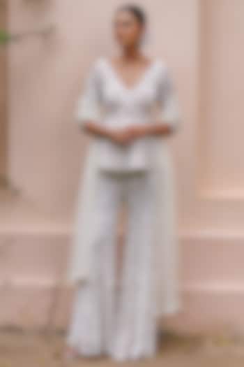 Pastel Ivory Net Floral Embroidered Bridal Sharara Set by MeenaGurnam at Pernia's Pop Up Shop