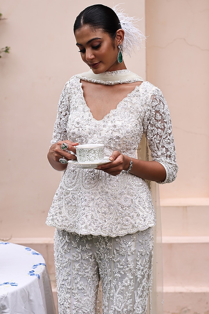 Pastel Ivory Net Floral Embroidered Bridal Sharara Set by MeenaGurnam at Pernia's Pop Up Shop