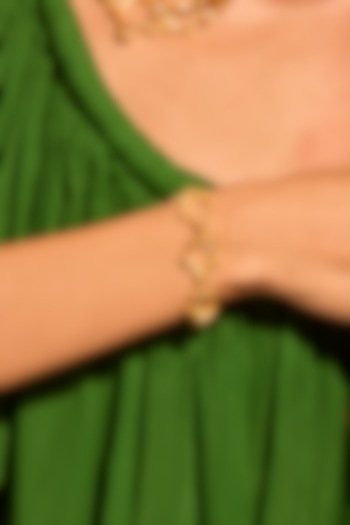 Gold Plated Brass Fluid Curve Bracelet by MNSH at Pernia's Pop Up Shop