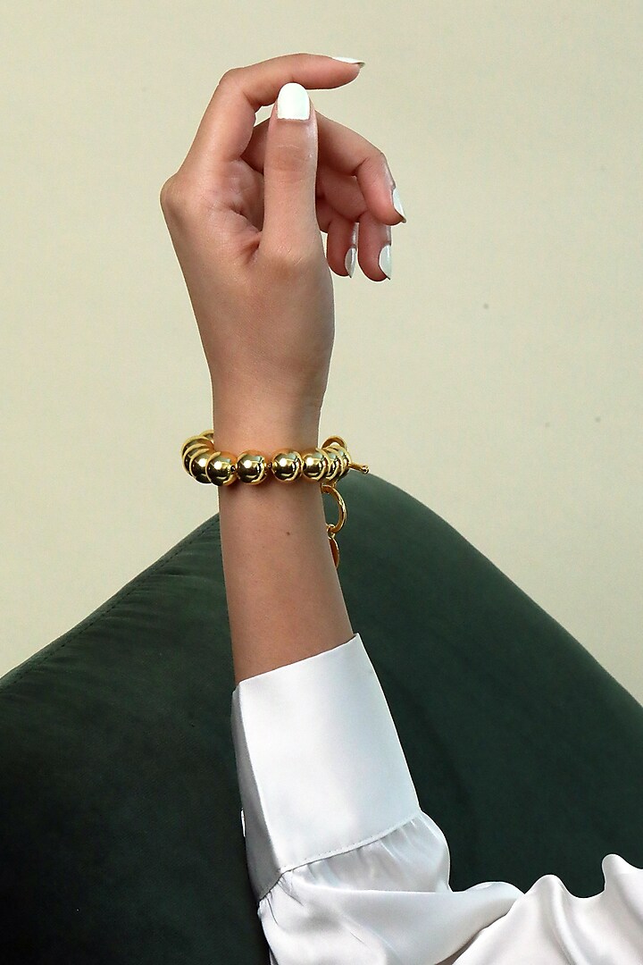 Gold Finish Bracelet In Brass by MNSH at Pernia's Pop Up Shop