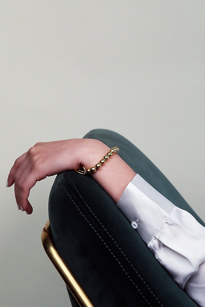 Gold Finish Mini Bracelet In Brass by MNSH at Pernia's Pop Up Shop