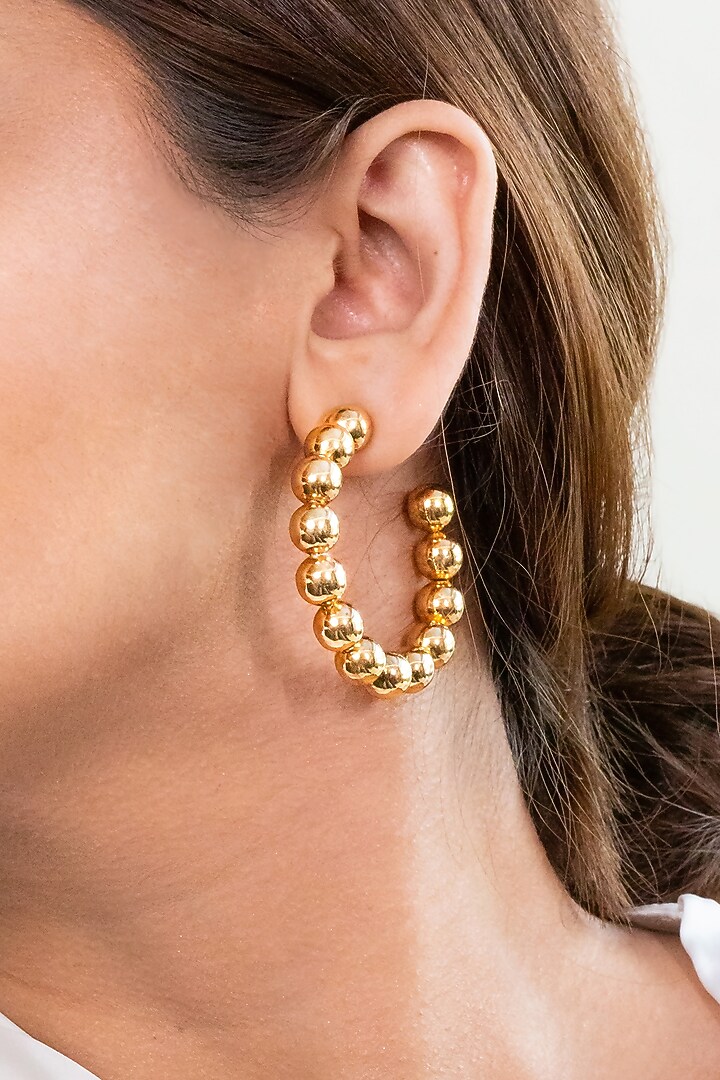 Gold Finish Hoop Earrings In Brass by MNSH at Pernia's Pop Up Shop