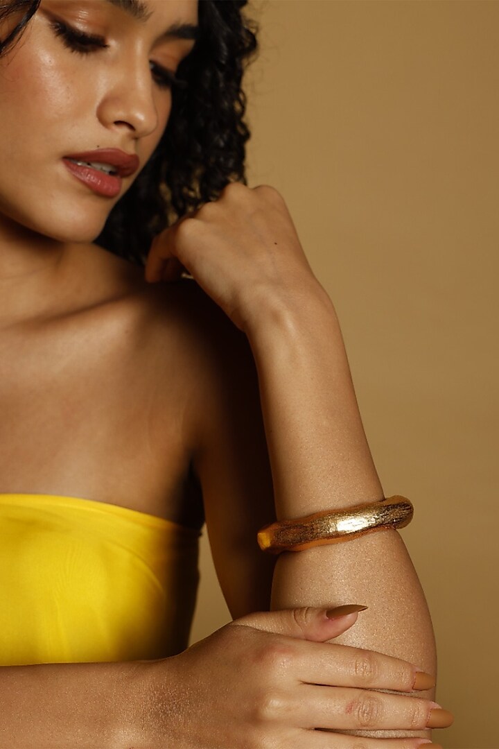 Gold Finish Jupiter Bangle by MNSH at Pernia's Pop Up Shop