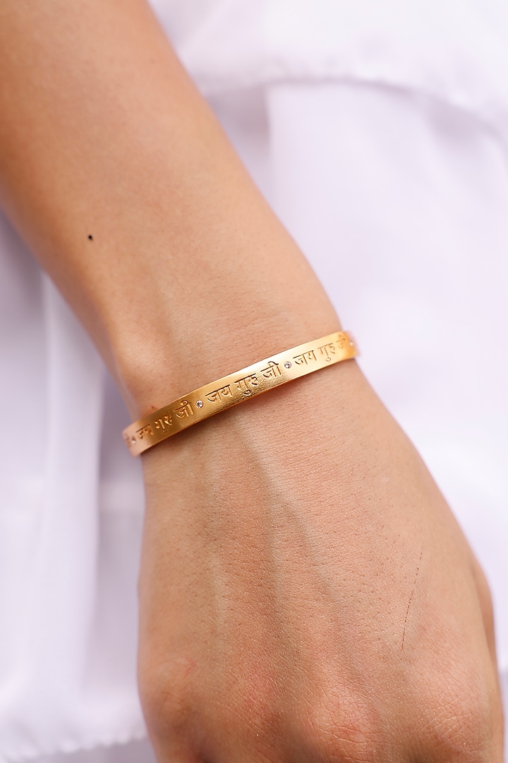 Gold Finish Jai Guruji Cuff by MNSH at Pernia's Pop Up Shop