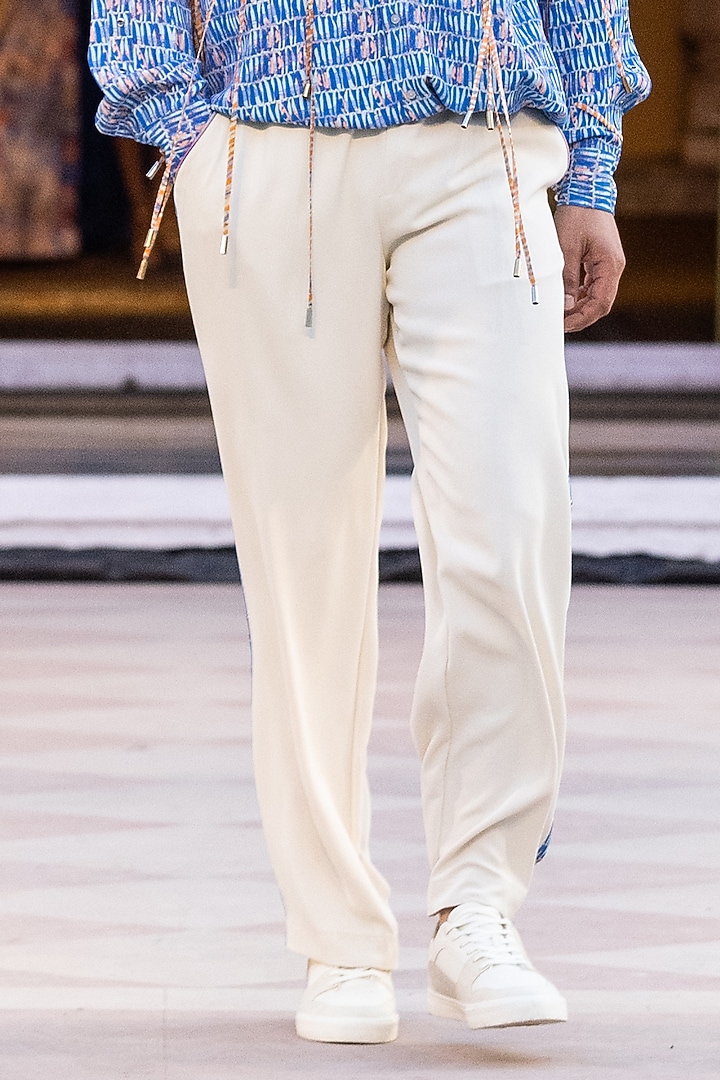 Ivory French Twill Lycra Trousers by Mandira Wirk Men at Pernia's Pop Up Shop