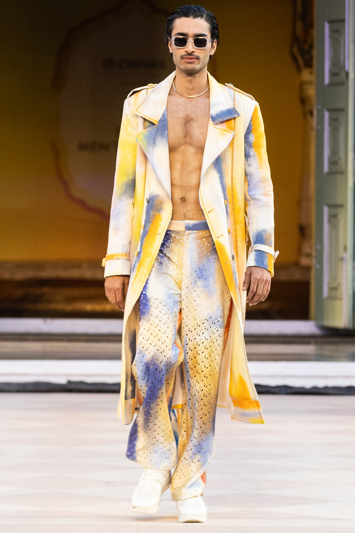 Yellow Foma Fabric Printed Trousers by Mandira Wirk Men