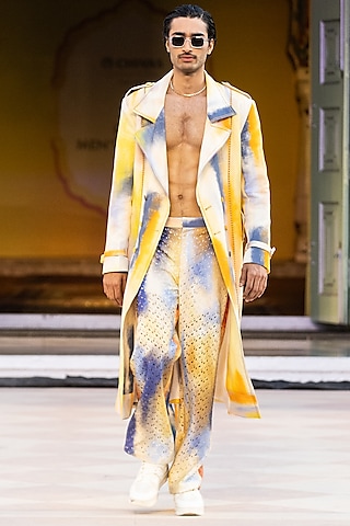 Yellow Foma Fabric Printed Trousers by Mandira Wirk Men
