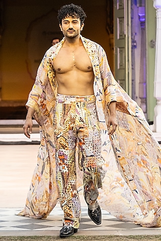 Yellow Foma Fabric Printed Trousers by Mandira Wirk Men