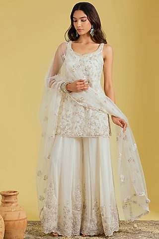 Ivory Net & Georgette Embroidered Sharara Set by MeenaGurnam