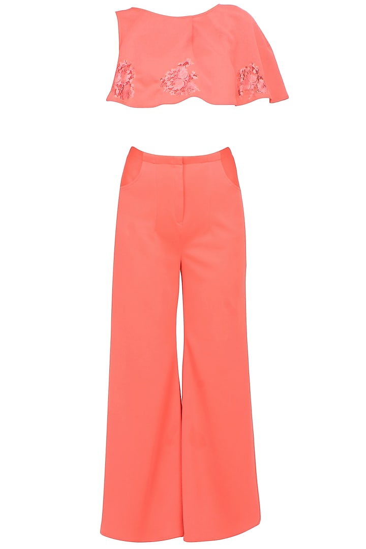 Peach amber overaly crop top and flared pants set by Manika Nanda