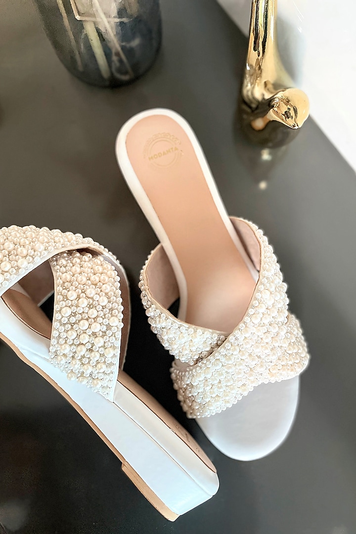 White Artificial Leather Pearl Handmade Cross Strapped Wedges by Modanta at Pernia's Pop Up Shop