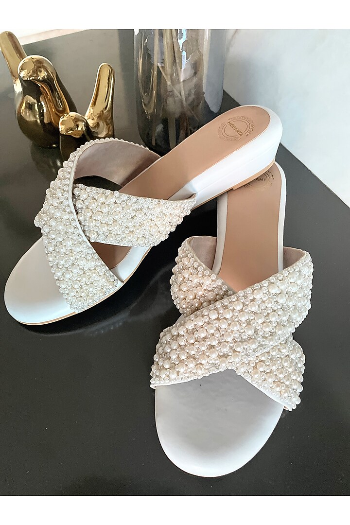 White Artificial Leather Pearl Handmade Cross Strapped Wedges by Modanta at Pernia's Pop Up Shop
