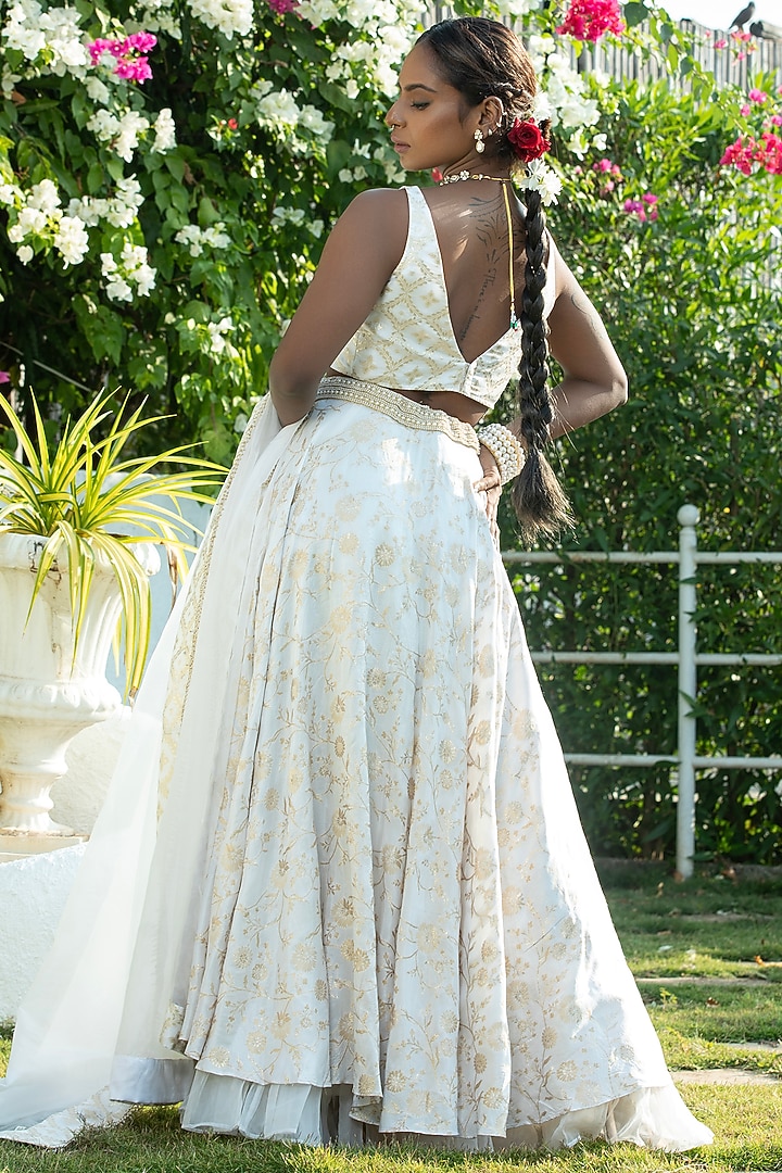 Ivory Brocade & Organza Layered Lehenga Set by Monk & Mei at Pernia's Pop Up Shop