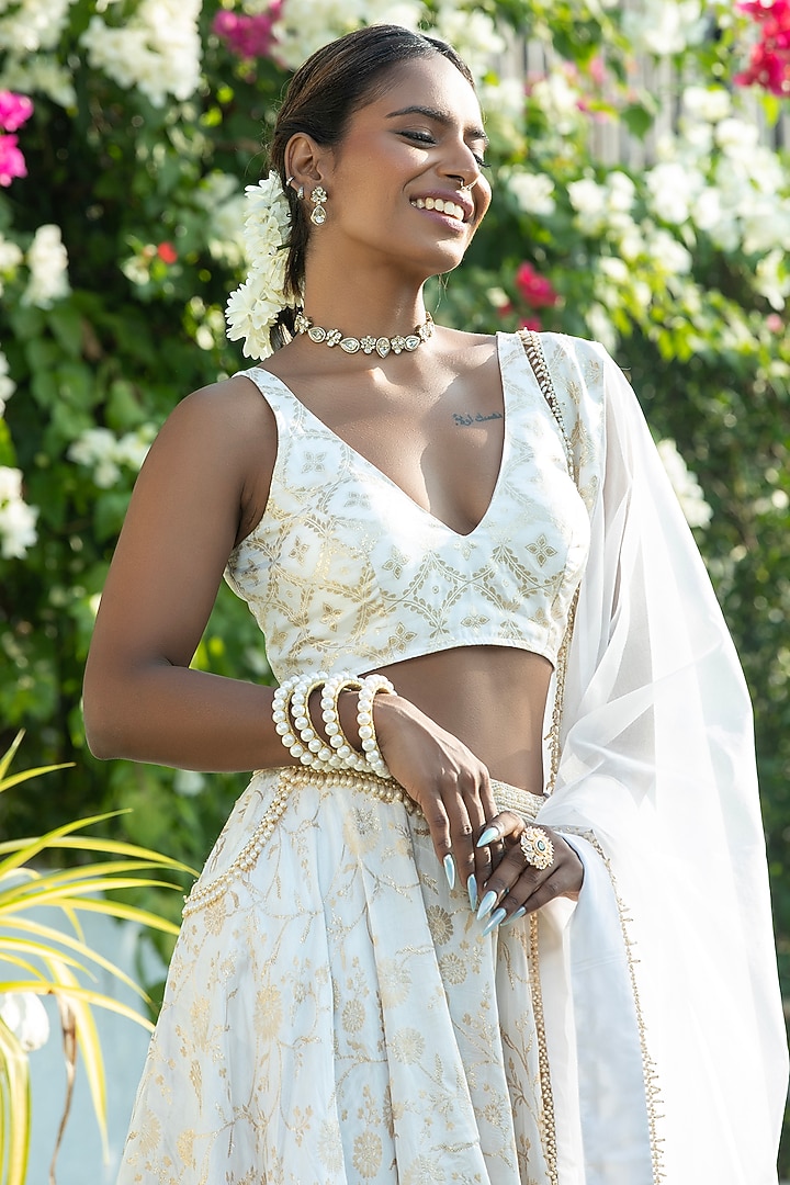 Ivory Brocade & Organza Layered Lehenga Set by Monk & Mei at Pernia's Pop Up Shop