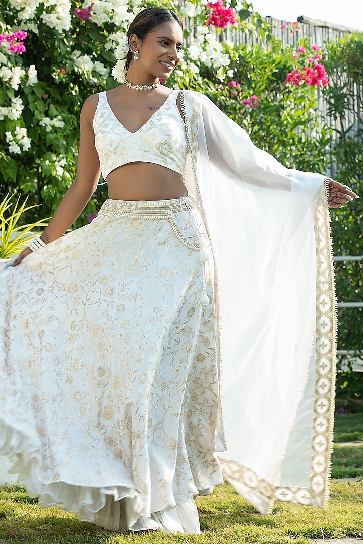 Ivory Brocade & Organza Layered Lehenga Set by Monk & Mei at Pernia's Pop Up Shop
