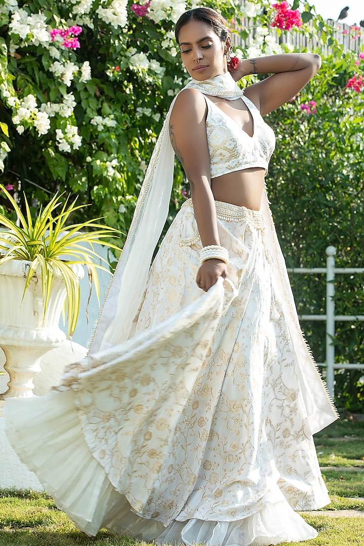 Ivory Brocade & Organza Layered Lehenga Set by Monk & Mei at Pernia's Pop Up Shop
