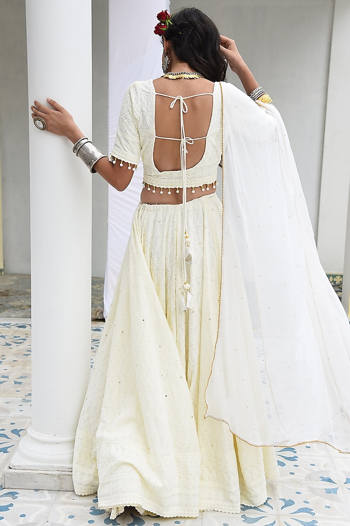 Cream Embroidered Lehenga Set by Monk & Mei at Pernia's Pop Up Shop