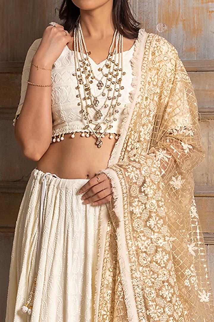 Ivory Embroidered Lehenga Set by Monk & Mei at Pernia's Pop Up Shop
