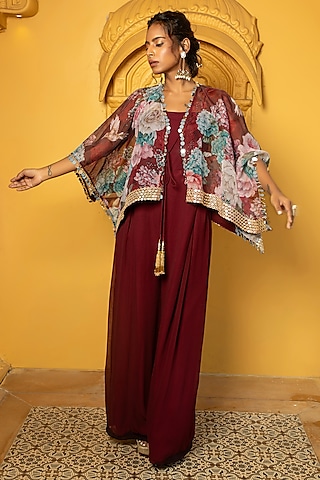 Maroon Georgette Jumpsuit With Floral Printed Cape by Monk & Mei