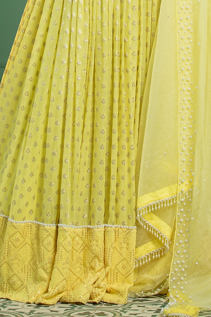 Yellow Georgette Embroidered Pleated Lehenga Set by Monk & Mei at Pernia's Pop Up Shop