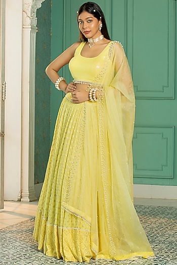 Yellow Georgette Embroidered Pleated Lehenga Set by Monk & Mei at Pernia's Pop Up Shop