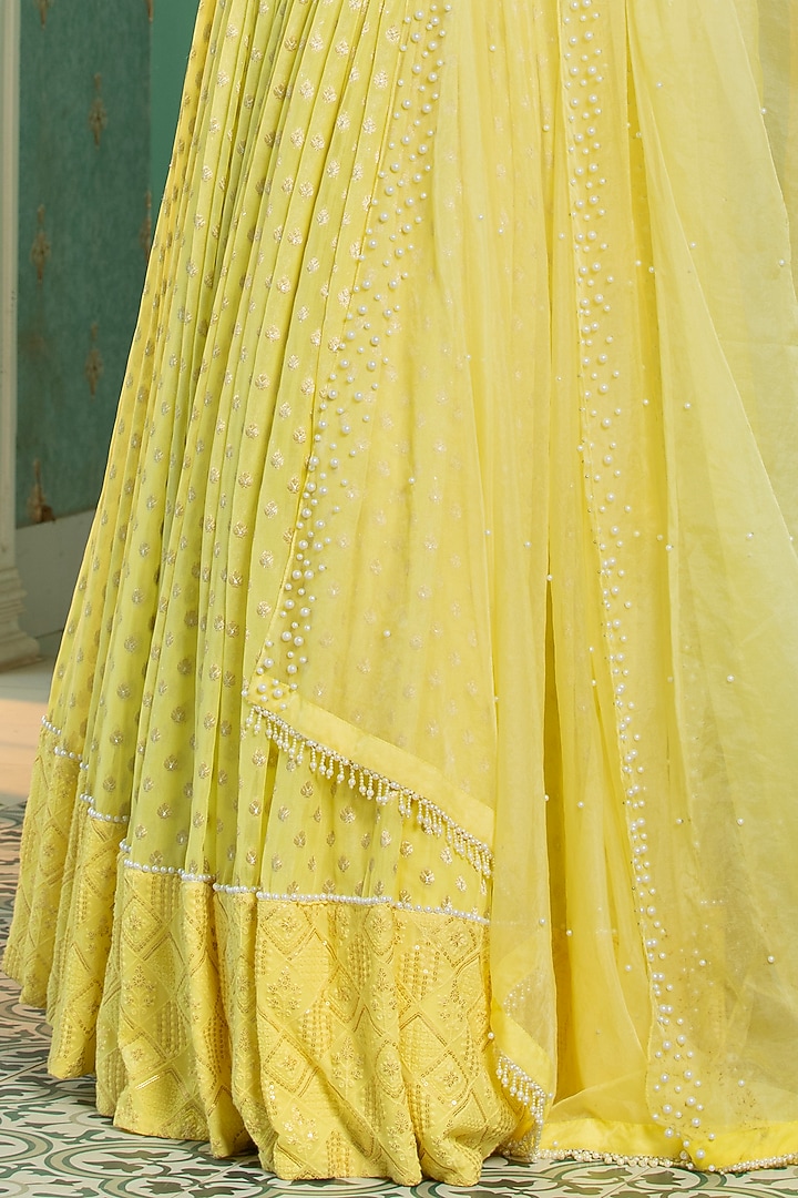 Yellow Georgette Embroidered Pleated Lehenga Set by Monk & Mei at Pernia's Pop Up Shop