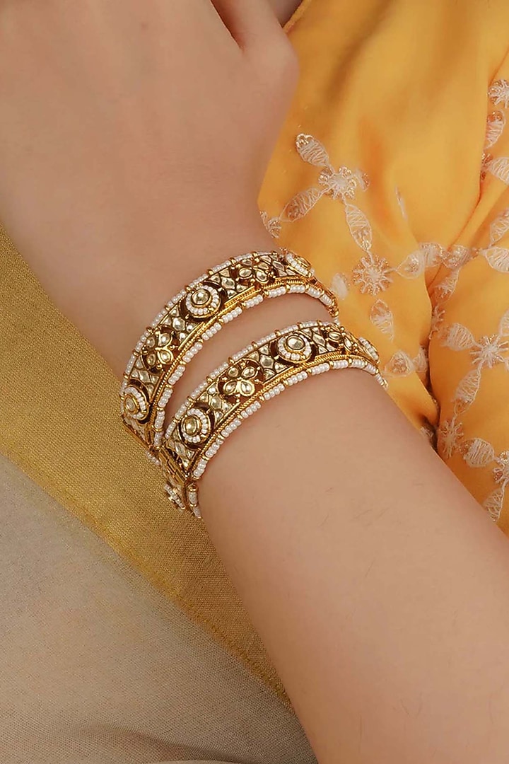 Gold Plated Uncut Polki & Beaded Jadau Bangles (Set Of 2) by Mortantra at Pernia's Pop Up Shop