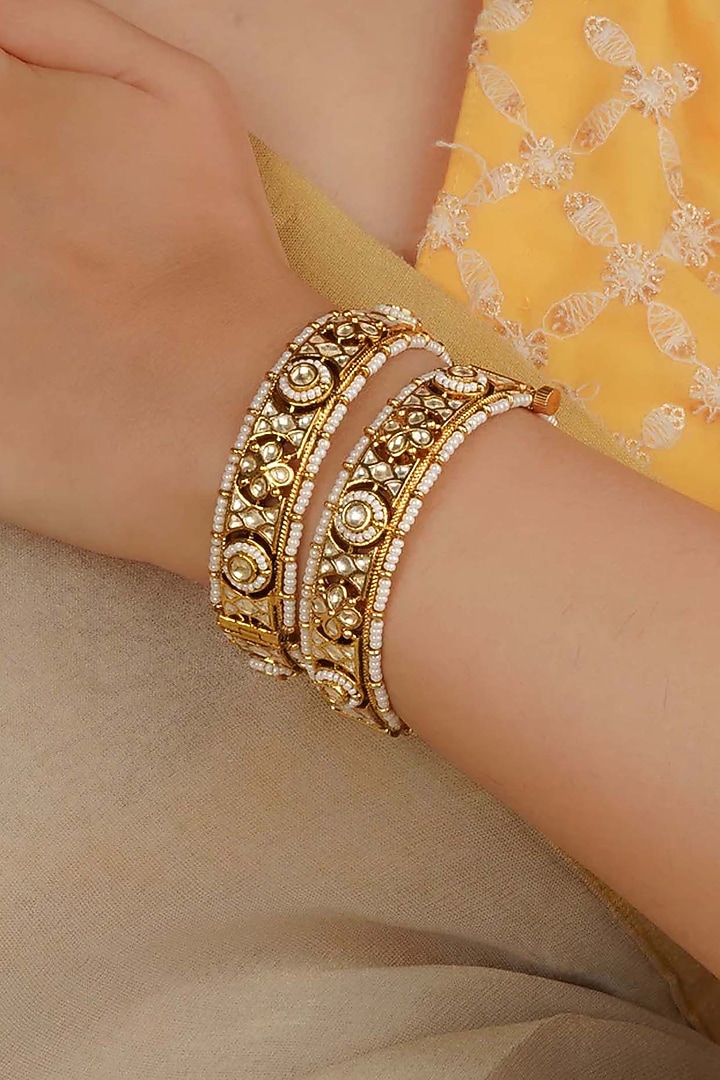 Gold Plated Uncut Polki & Beaded Jadau Bangles (Set Of 2) by Mortantra at Pernia's Pop Up Shop