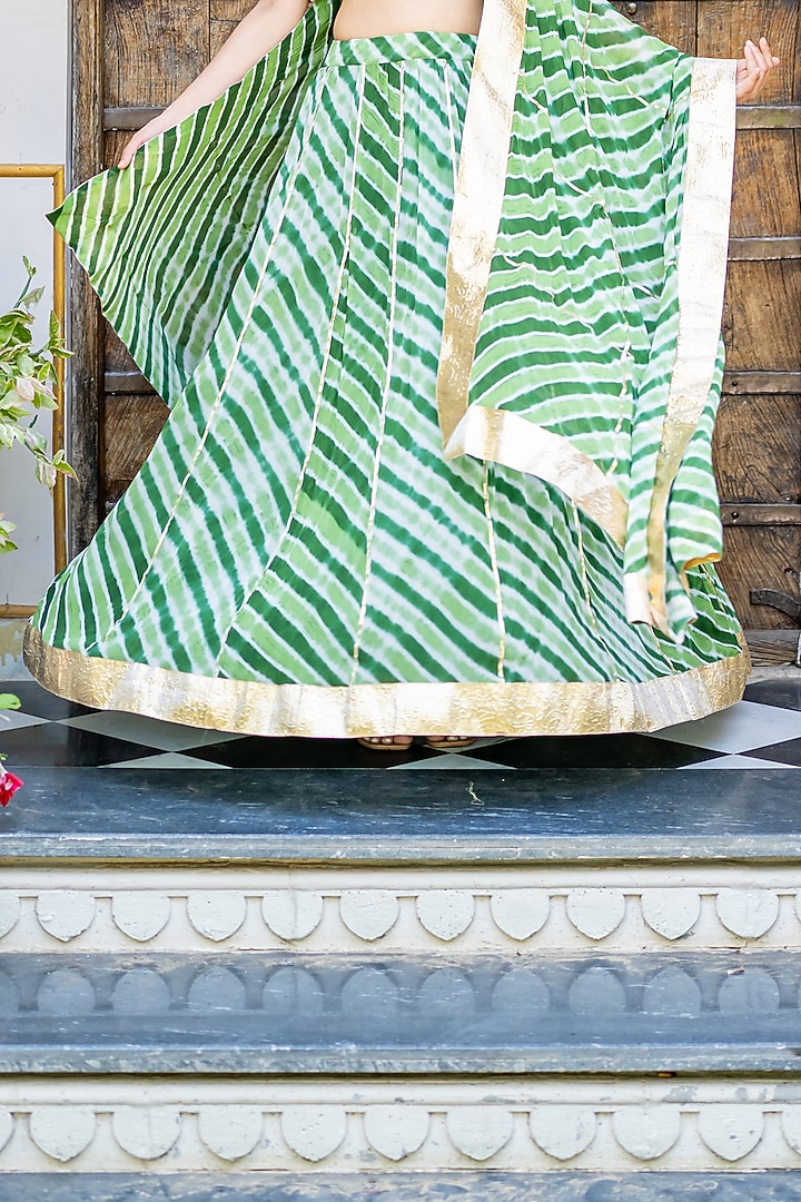 Green Viscose Georgette Leheriya Printed Lehenga Set by House Of Jamoti at Pernia's Pop Up Shop