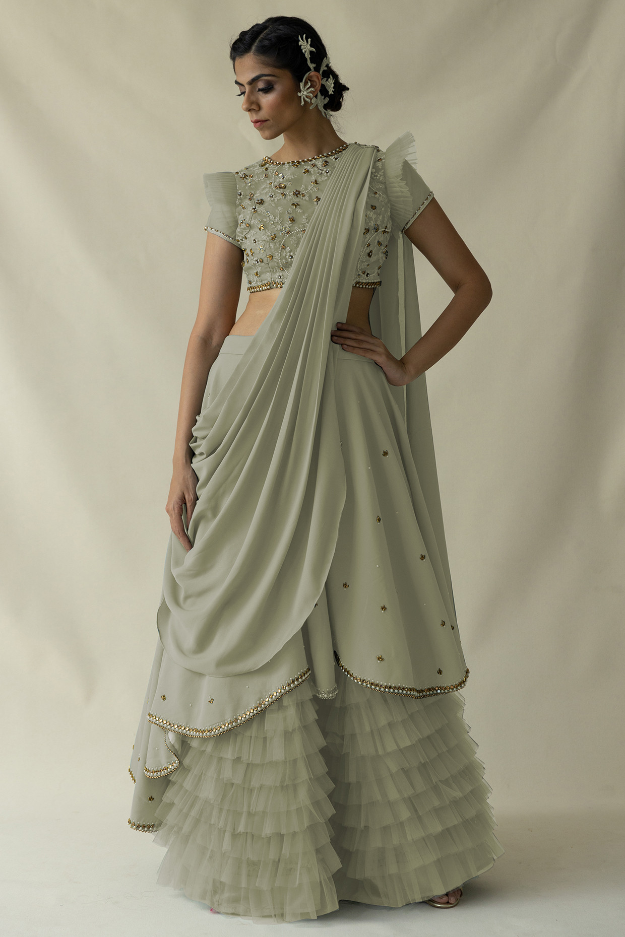 Sage Green Net Ruffled Lehenga Set by Merge Design at Pernia's Pop Up Shop