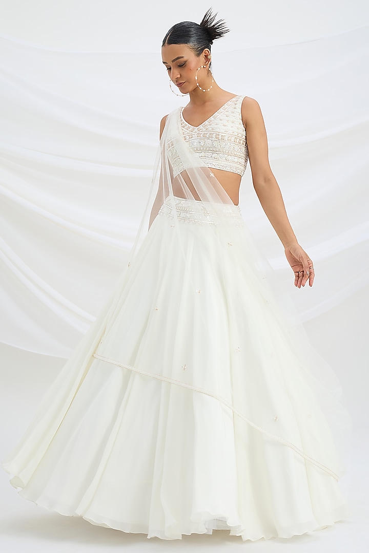 Ivory Viscose Crepe Embroidered Wedding Lehenga Set by Mirroir at Pernia's Pop Up Shop
