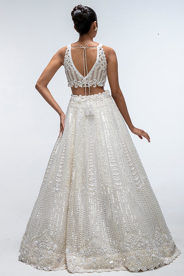 Ivory Illume Pure Silk Sequins Embellished Bridal Lehenga Set by Mirroir at Pernia's Pop Up Shop