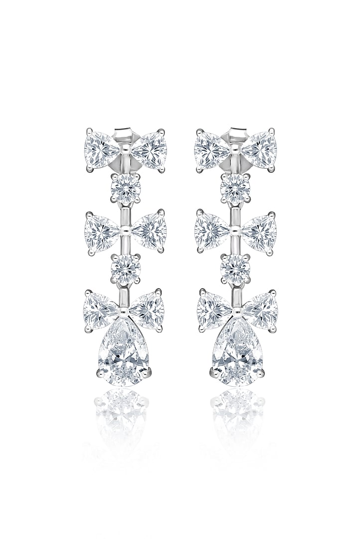 White Rhodium Finish Cubic Zirconia Luminous Bow Dangler Earrings In Sterling Silver by MISS JO at Pernia's Pop Up Shop