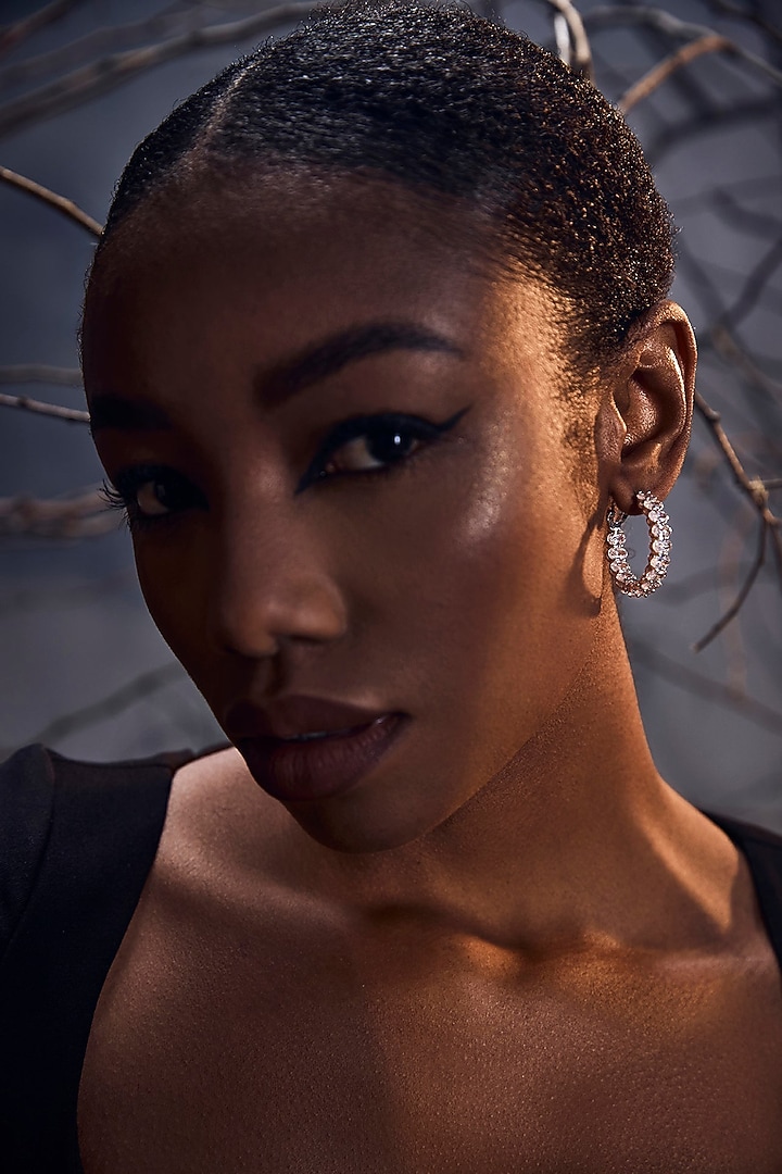 White Rhodium Finish Cubic Zirconia Regal Muse Hoop Earrings In Sterling Silver by MISS JO at Pernia's Pop Up Shop