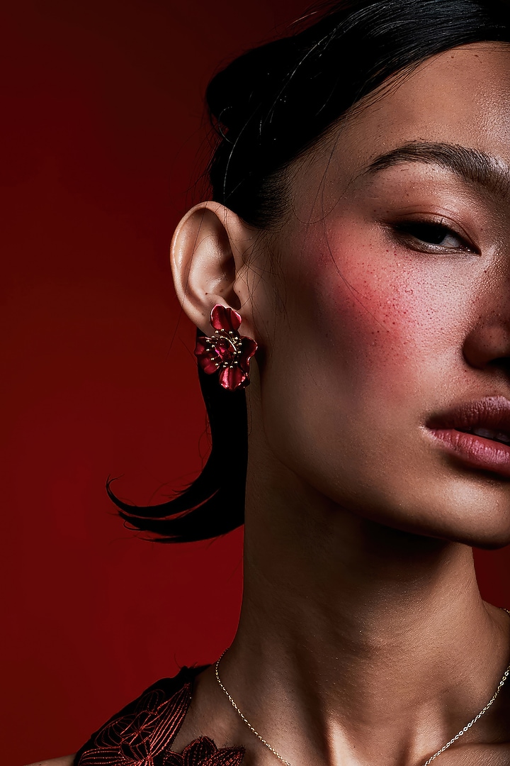 Gold Finish Cubic Zirconia & Red Stone Floral Stud Earrings In Sterling Silver by MISS JO at Pernia's Pop Up Shop