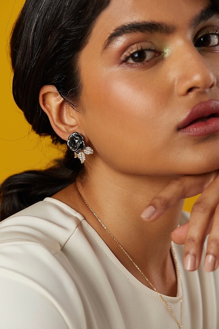 Gold Finish Cubic Zirconia & Black Stone Floral Stud Earrings In Sterling Silver by MISS JO at Pernia's Pop Up Shop