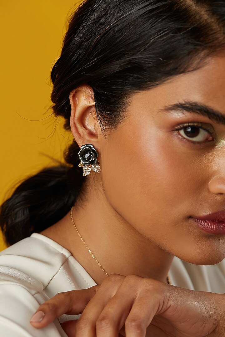 Gold Finish Cubic Zirconia & Black Stone Floral Stud Earrings In Sterling Silver by MISS JO at Pernia's Pop Up Shop