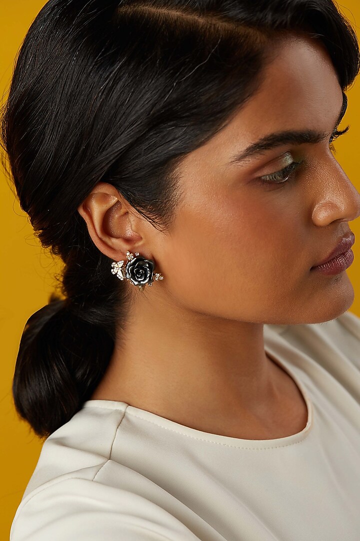 Gold Finish Cubic Zirconia & Black Stone Floral Stud Earrings In Sterling Silver by MISS JO at Pernia's Pop Up Shop
