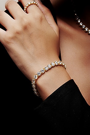 Gold Finish Cubic Zirconia Crystal Tennis Bracelet In Sterling Silver by MISS JO at Pernia's Pop Up Shop