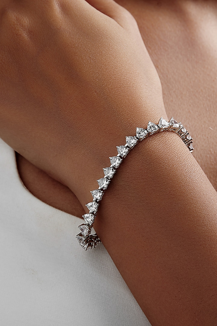 White Rhodium Finish Heart-Shaped Cubic Zirconia Crystal Tennis Bracelet In Sterling Silver by MISS JO at Pernia's Pop Up Shop